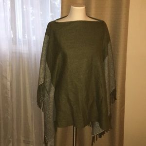 Green knit cape with fringe
